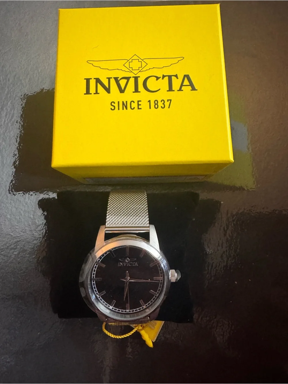 Invicta Men’s Silver Mesh Strap Watch with Black Dial and Yellow Box Accent